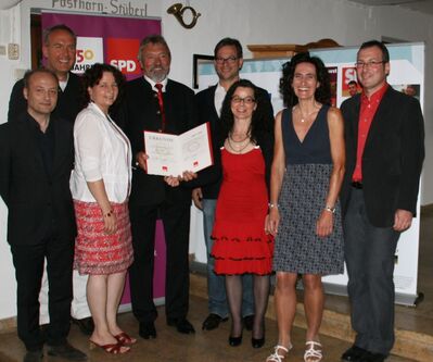 Ehrenvorsitzender Arno Wolf im Kreise der Ehrengäste